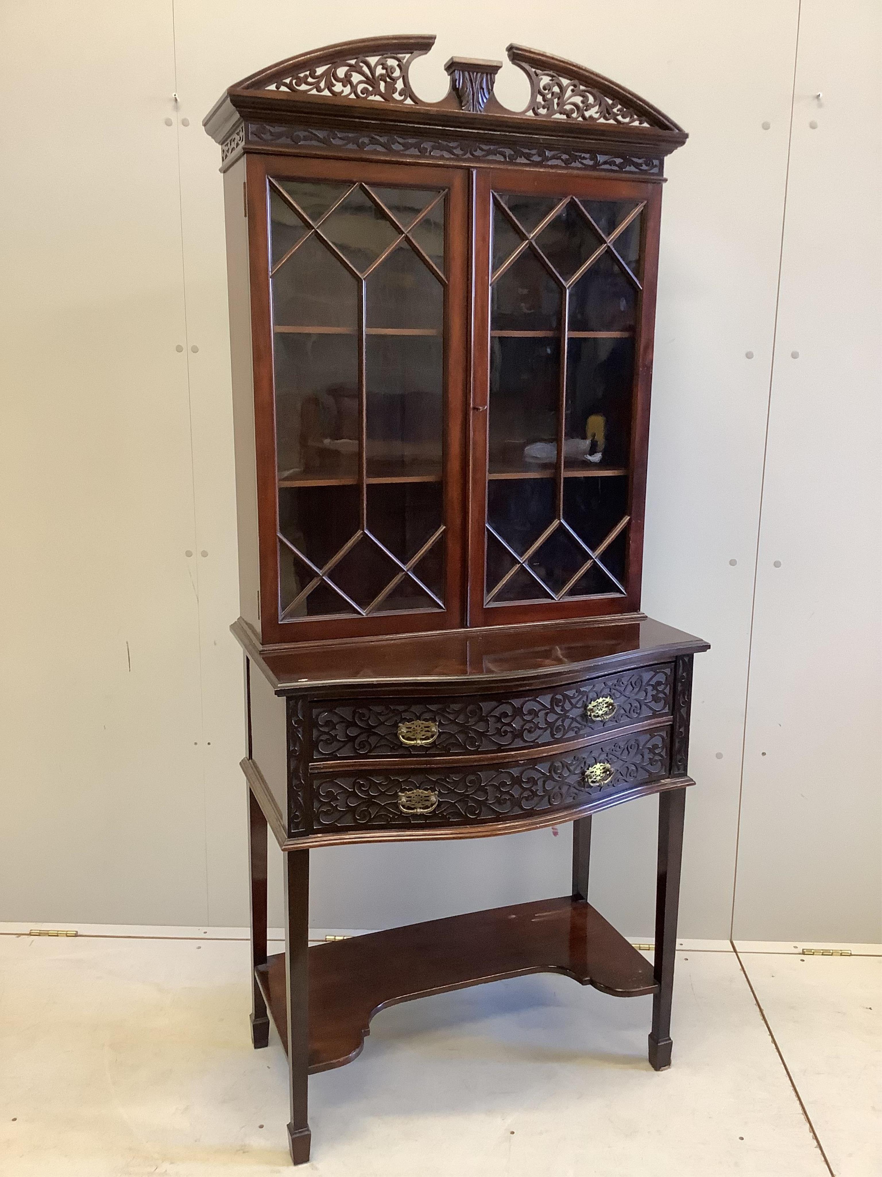 An Edwardian Chippendale Revival blind fret bowfront mahogany bookcase, width 76cm, depth 44cm, height 180cm